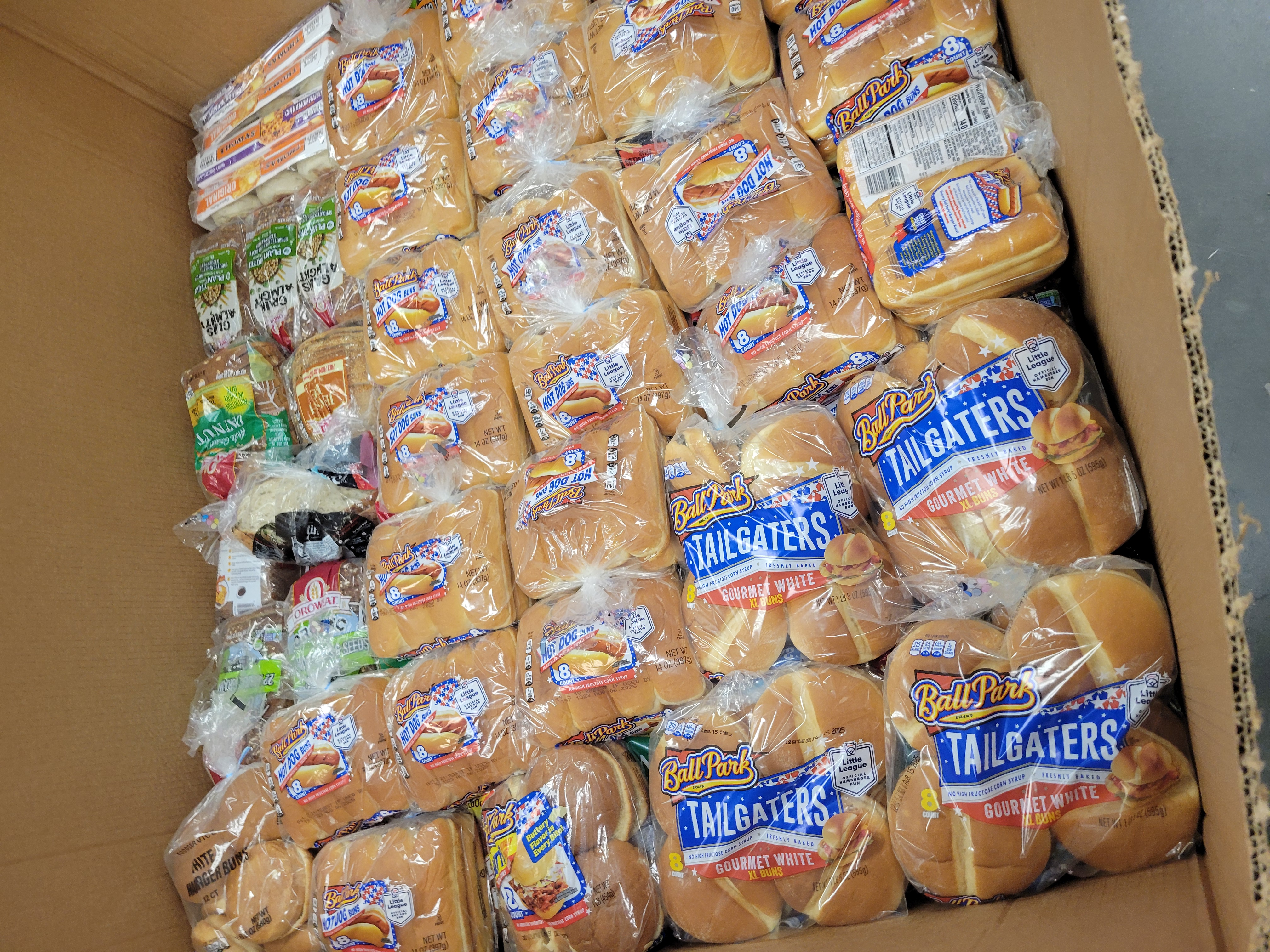 Cardboard container filled with bread.